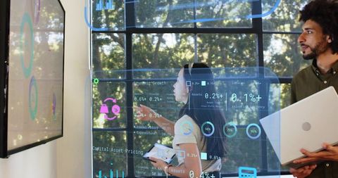 Team Collaborating with Transparent Data Dashboards and Tablet in Sunlit Modern Office