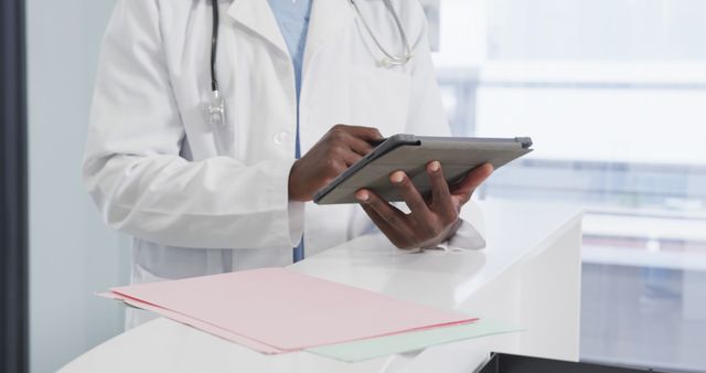 Doctor Using Digital Tablet at Reception Desk - Download Free Stock Images Pikwizard.com