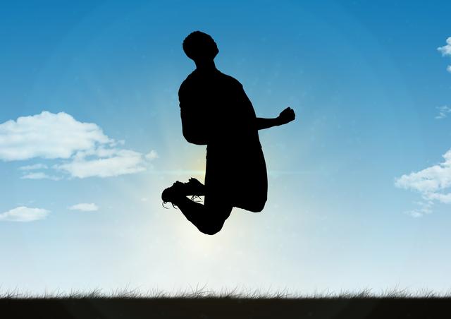 Silhouette of a man captured mid-jump expressing excitement against a vivid blue sky with fluffy clouds. Perfect for illustrating concepts of achievement, happiness, and euphoric emotional moments. Suitable for motivational posters, sports event promotions, fitness and wellness campaigns, and outdoor adventure advertisements.