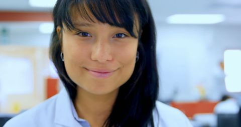 Smiling female scientist in blood laboratory environment