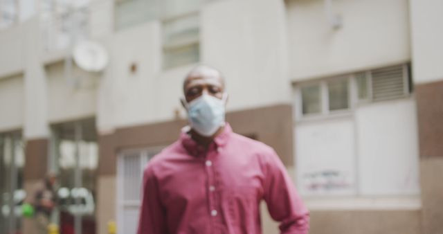 Blurred View of Man Wearing Face Mask in Urban Area - Download Free Stock Images Pikwizard.com