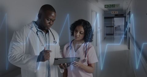Healthcare Professionals Analyzing Patient Data on Digital Tablet