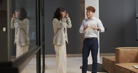 Business Professionals Discussing Project in Modern Office Hallway