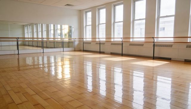 Sunlit Ballet Studio with Polished Parquet Floor, Wall Barres and Floor Mirrors