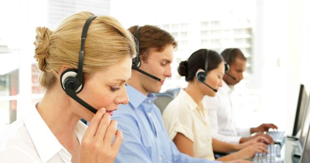 Customer Service Representatives Using Headsets in Office Environment - Download Free Stock Images Pikwizard.com