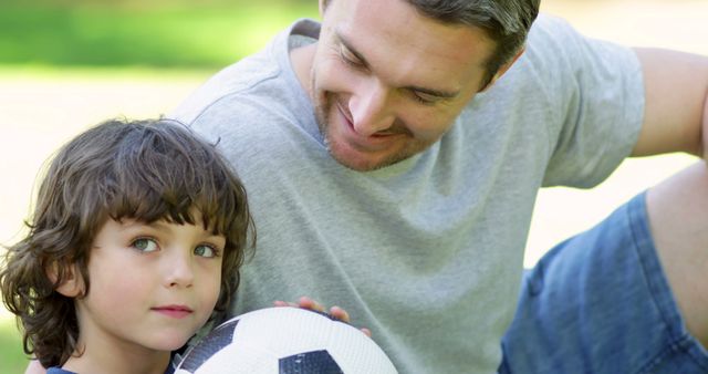 Father and son bonding with soccer ball outdoors - Download Free Stock Images Pikwizard.com
