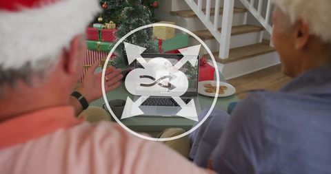 Elderly Couple Video Calling Family During Christmas Celebration