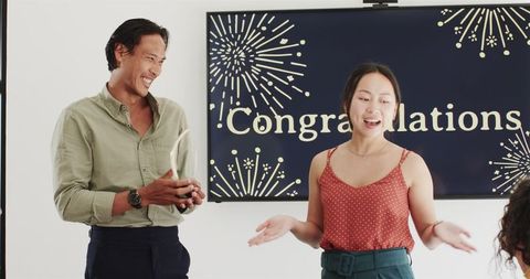 Joyful office celebration with congratulations