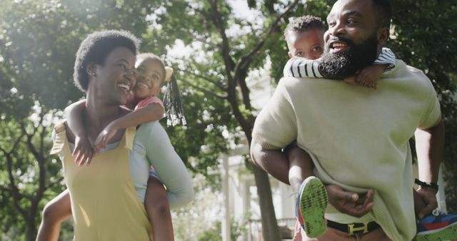 Happy African American Family Enjoying Outdoor Playful Time Together - Download Free Stock Images Pikwizard.com