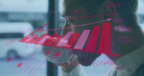 Business Professional Analyzing Financial Data While Drinking Coffee