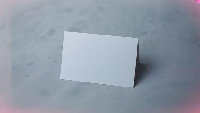 Blank White Folded Tent Card on Soft Gray Background