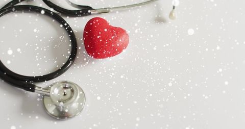 Red heart with stethoscope on clean white background for cardiac care and heart health campaigns