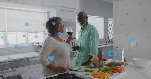 Senior Couple Enjoying Wine with Digital Connections Concept