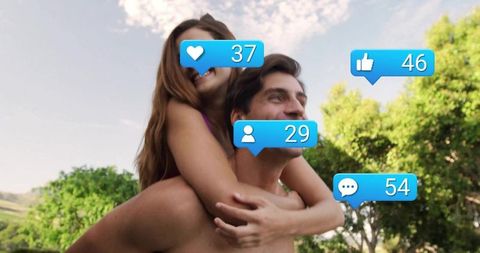 Joyful Couple Embracing amidst Nature with Social Media Engagement Icons