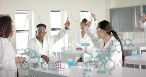 Chinese student raising hand in chemistry lab with classmates conducting experiments
