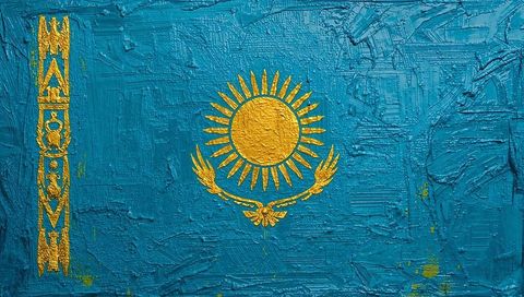 Kazakhstan flag impasto art featuring gold sun and steppe eagle on turquoise canvas