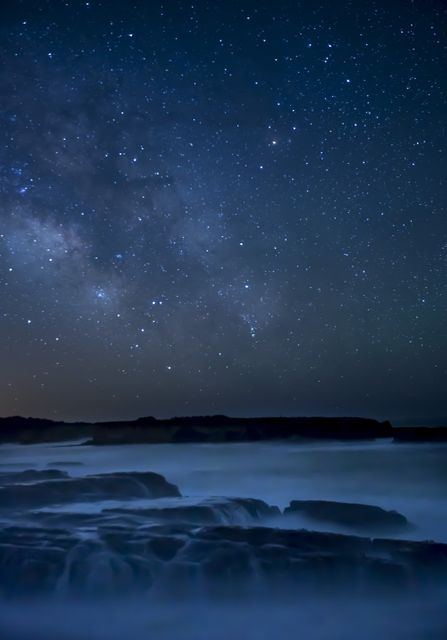 Starry Night Sky Over Foggy Coastal Waters - Download Free Stock Photos Pikwizard.com