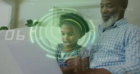 Black grandfather guiding granddaughter on laptop with holographic HUD for learning