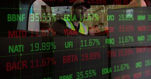 Logistics Worker Stacking Boxes Amidst Overlay of Stock Market Data
