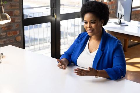 Confident Professional Woman in Bright Modern Office Talk Meeting