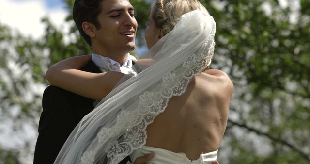 Bride and Groom Embracing Outdoors on Wedding Day - Download Free Stock Images Pikwizard.com