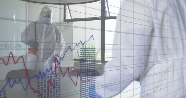 Healthcare worker in protective gear disinfecting office amid pandemic with financial graphs - Download Free Stock Images Pikwizard.com