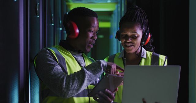 Engineers Collaborating in Data Center with Digital Tablet and Laptop - Download Free Stock Photos Pikwizard.com