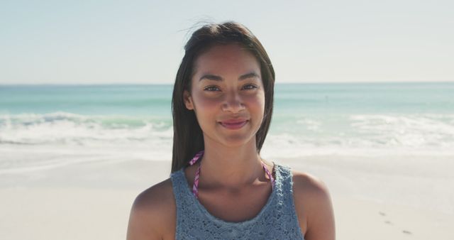 Portrait of asian woman smiling and standing on beach - Download Free Stock Photos Pikwizard.com