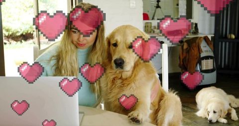 Woman with Golden Retriever and Heart Graphics on Laptop