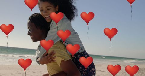 Couple with Heart Balloons on Beach in Valentine's Day Celebration