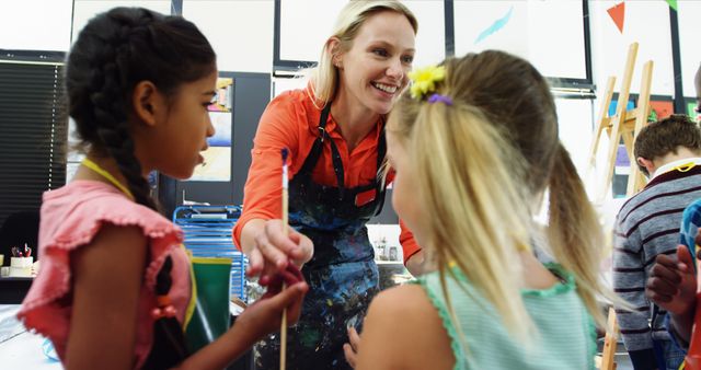 Smiling Teacher Interacting with Students in Art Class - Download Free Stock Images Pikwizard.com