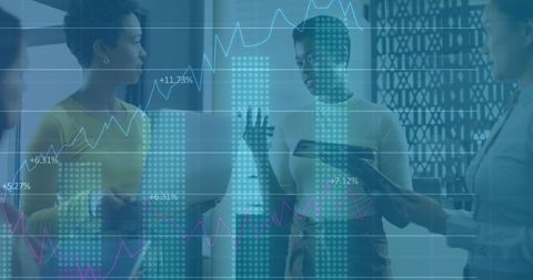 Diverse business people discussing data insights in modern office