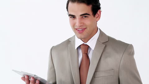 Confident Businessman Using Tablet in Professional Attire