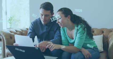 Couple Engaged in Data Analysis Seamlessly Using Technology