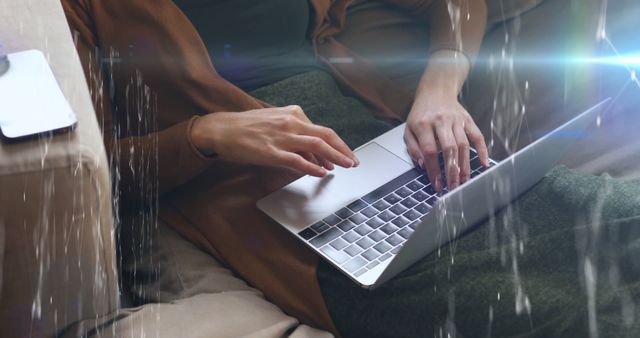 Person Using Laptop on Sofa in Cozy Home Environment - Download Free Stock Images Pikwizard.com