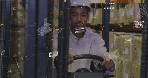 Warehouse worker operating forklift with data overlay technology
