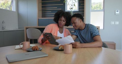 Playful Couple Having Breakfast Coffee at Home Kitchen