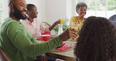 Multigenerational Family Enjoying Meal and Making a Toast