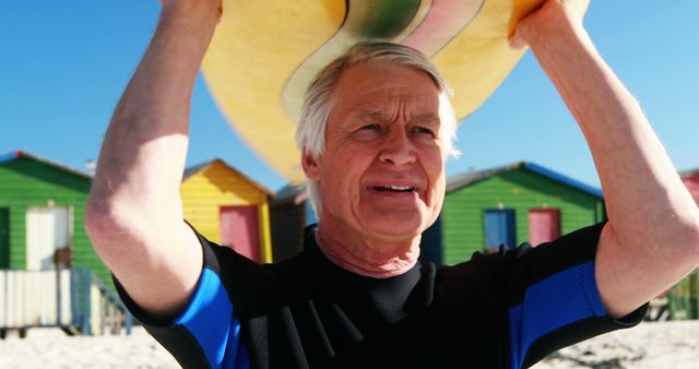 Senior Man Carries Surfboard At Colorful Beach - Download Free Stock Images Pikwizard.com