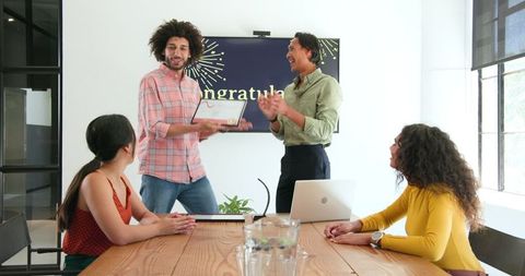 Team Celebrating Success with Certificate Award in Office