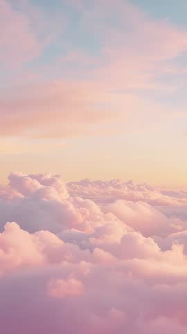 Drifting Pastel Clouds at Sunrise Vertical Aerial Video, Soft Pink Sky Shifting Colors Calm Backgrou