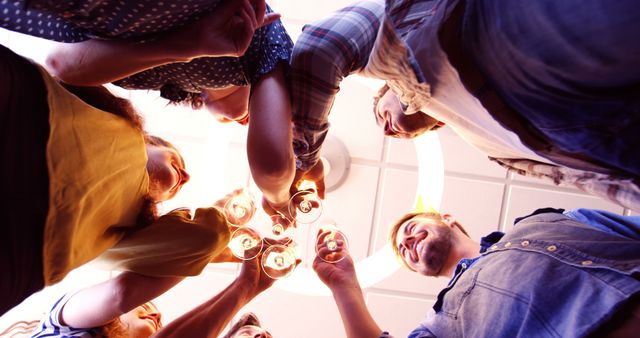 Friends Celebrating with Wine Glasses in Circular Formation - Download Free Stock Images Pikwizard.com