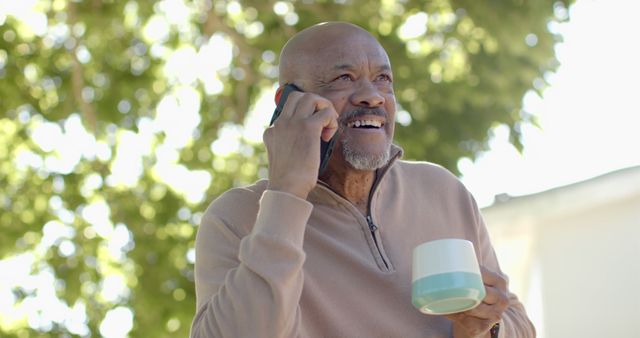 Mature African American Man Talking on Phone Outdoors - Download Free Stock Images Pikwizard.com