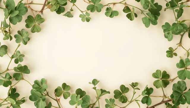 Framing Green Clover Border on Cream Background with Central Negative Space for Text