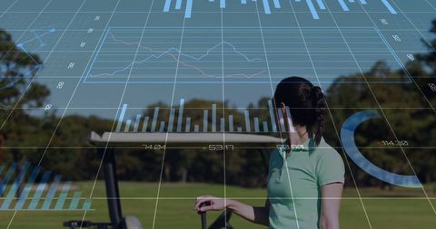 Female golfer analyzing real-time performance data on golf course