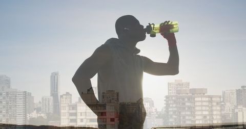 Fit Man Staying Hydrated During City Workout