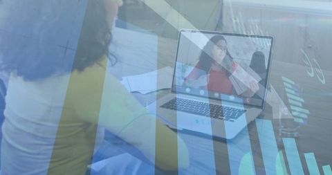 Woman reviewing documents while joining video meeting with analytics overlay