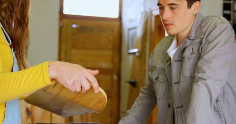 Young Friends Relaxing at Home with Drinks in Kitchen