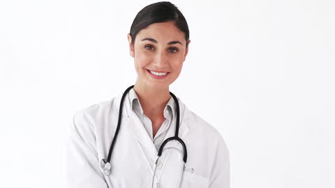 Smiling Nurse with Stethoscope Against White Background