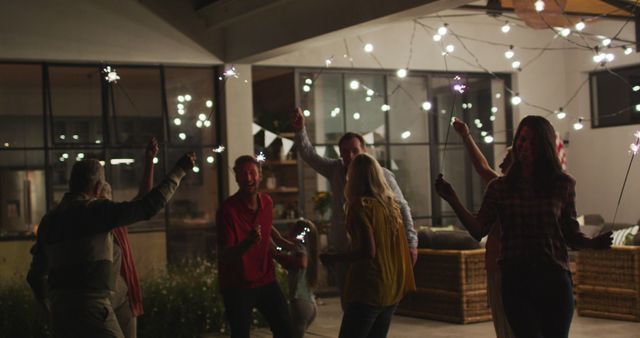 Family Celebration with Sparklers at Night - Download Free Stock Images Pikwizard.com